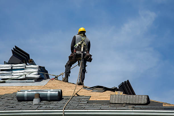 Professional Storm Damage Roof Repair technician working in Warm Springs, MT